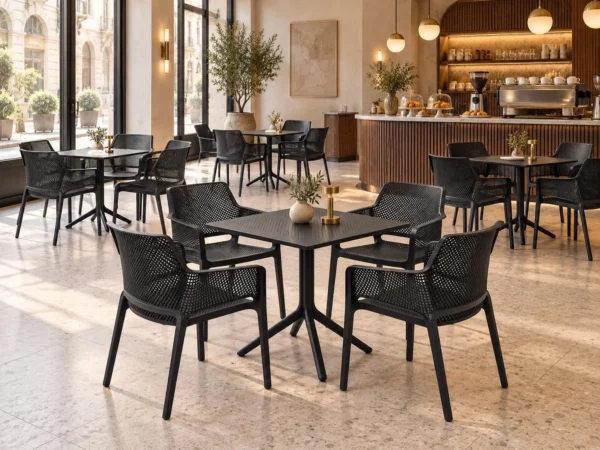 Crea armchairs with Moduline Punto table, 4-seater set in black on a restaurant terrace – Trend Concept